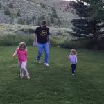 Bill Busbice playing with Emma and Ella