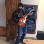 Bill Busbice playing the electric guitar